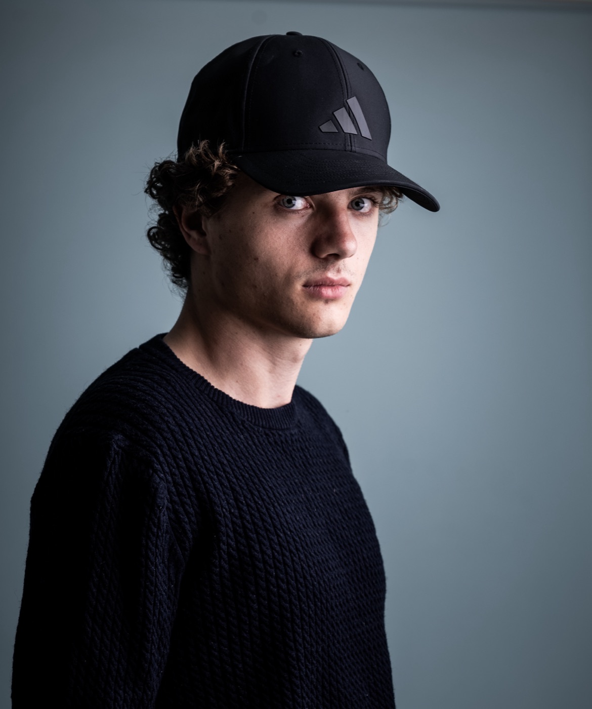 William Jannert — casual portrait in a cap and sweater
