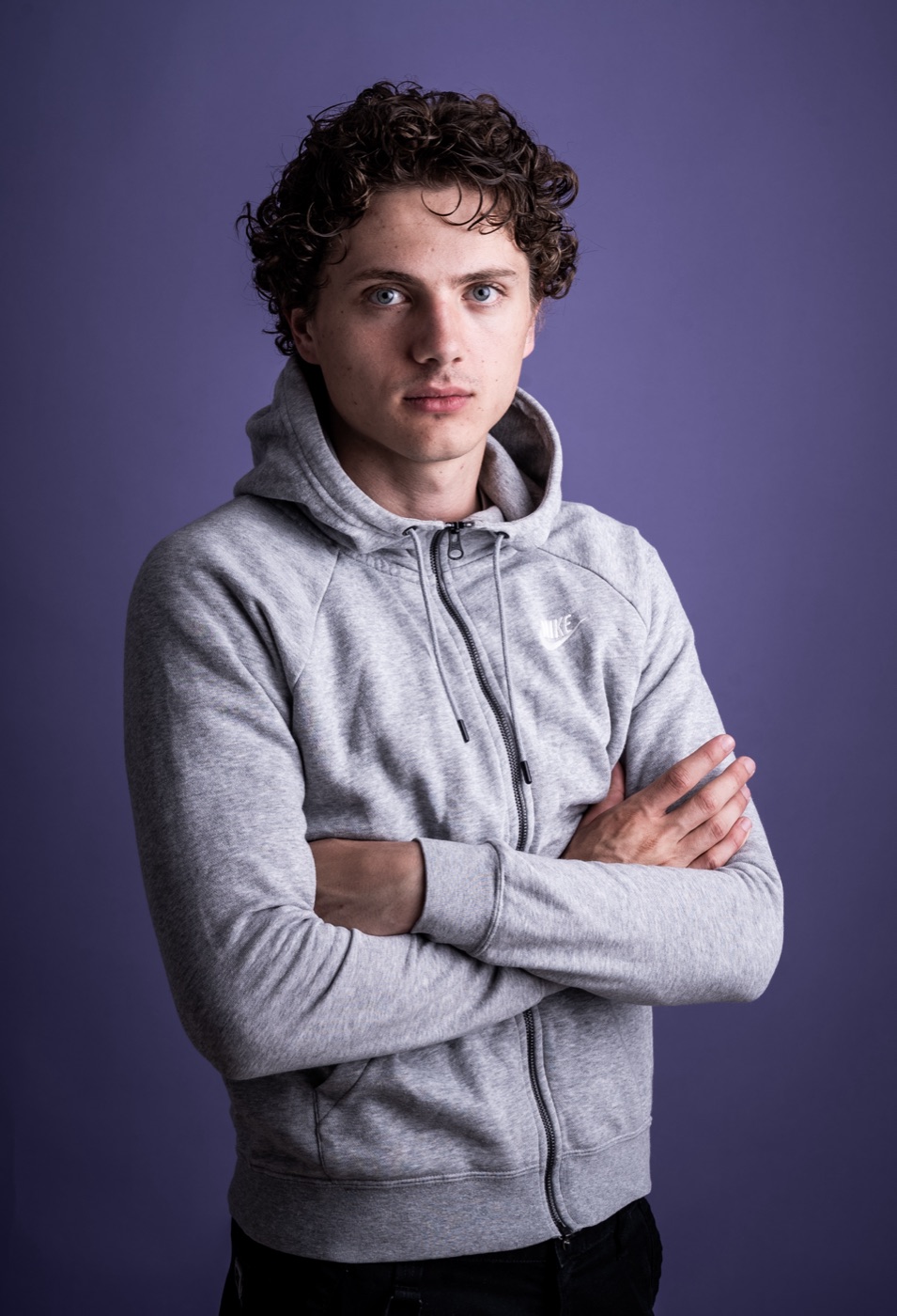 William Jannert — casual portrait in a grey hoodie